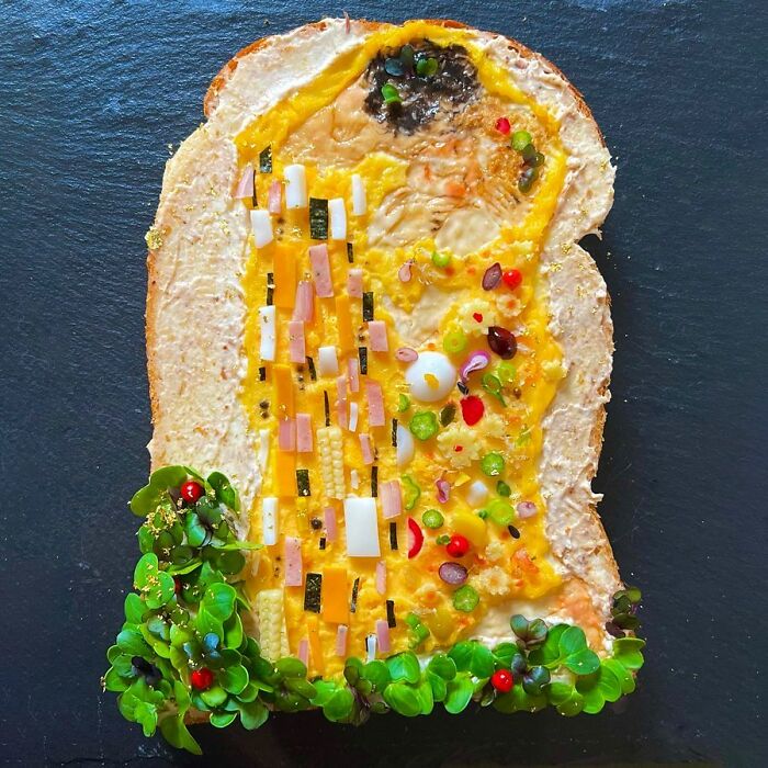 Creative toast design by Japanese artist, featuring vibrant toppings resembling a colorful landscape on a slice of bread.