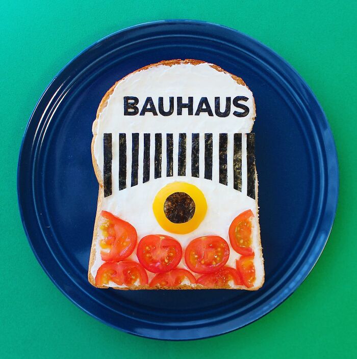 Creative toast design featuring "Bauhaus" theme with tomatoes and seaweed on a blue plate.