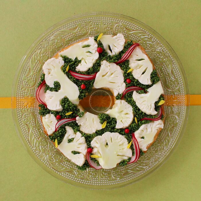 Creative toast design with cauliflower, greens, and radish, crafted by Japanese artist, displayed on a decorative plate.