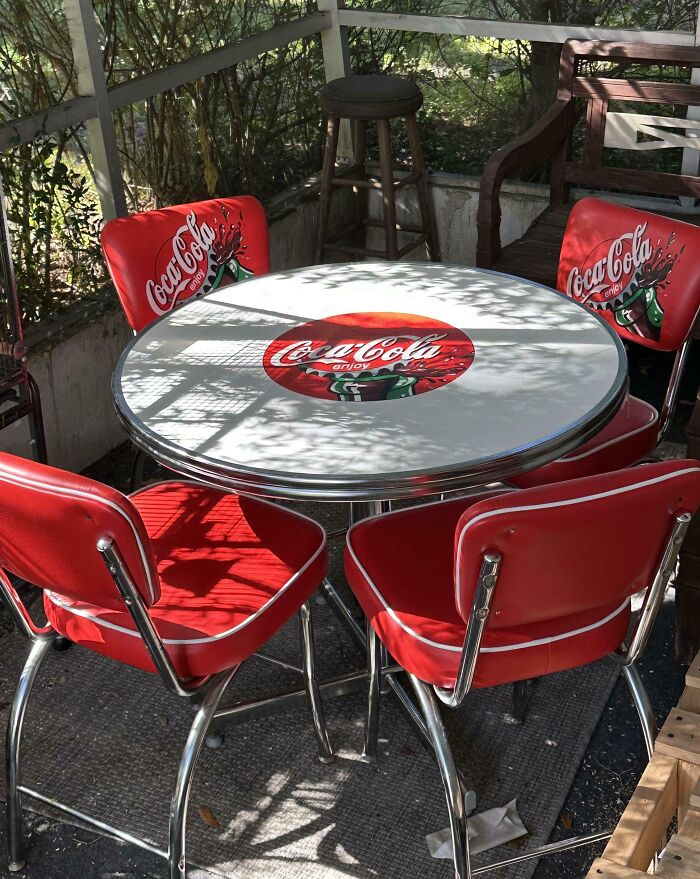 Retro Coca-Cola table and red chairs in a sunlit patio, a hidden gem find at Goodwill.