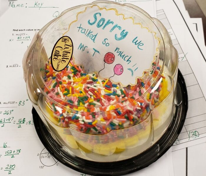 Colorful sprinkled cake with an apology note, a pure and uplifting moment to brighten your daily scroll.