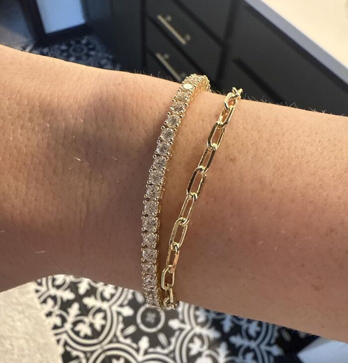 Close-up of stylish gold and diamond bracelets on wrist, perfect last minute Mother's Day gifts with elegant appeal.