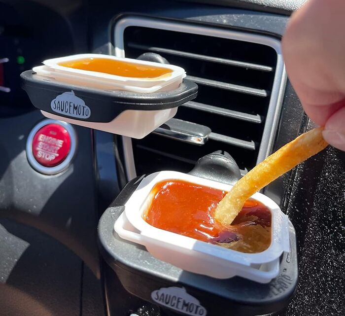 Car vent sauce holders with ketchup and honey mustard for easy dipping fries, a practical last minute Mother's Day gift idea.