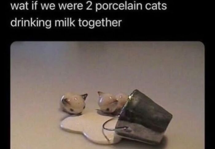 Two porcelain cats spilled milk from a tipped metal cup, illustrating a wholesome meme about friendship.