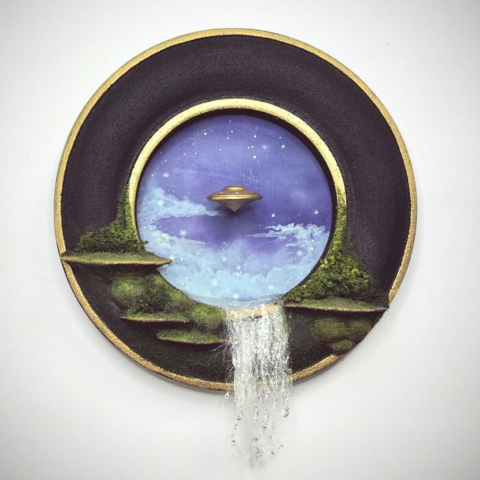 Alien-themed diorama by Caroline Dewison, featuring a UFO in a starry sky with cascading waterfall elements.