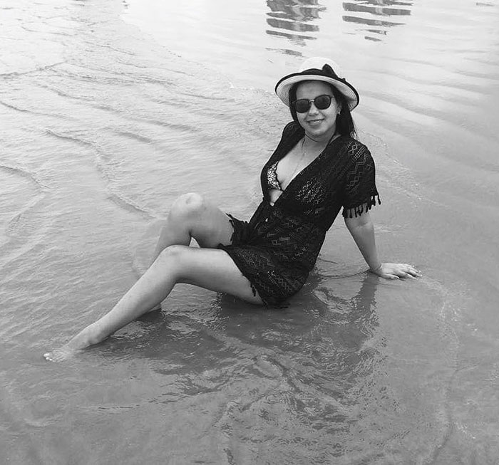 Woman sitting on the beach, wearing sunglasses and a hat, relevant to medical students' controversy. Woman sitting on the beach, wearing sunglasses and a hat, relevant to medical students' controversy.