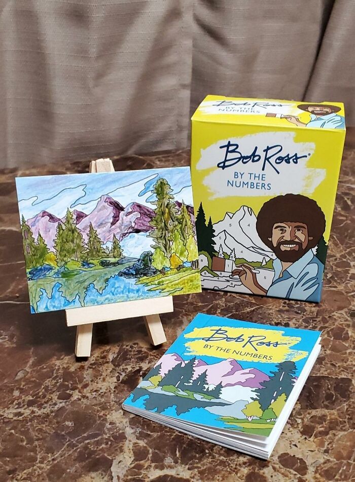 Bob Ross by the Numbers paint-by-number kit with a colorful mountain landscape, perfect to unleash your inner child.