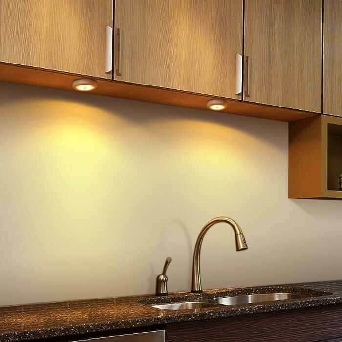 Modern kitchen sink setup with under-cabinet lighting, ideal for solo living essentials.