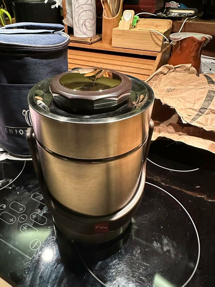 Stainless steel food container on a kitchen countertop, ideal for easy meal prep solutions.