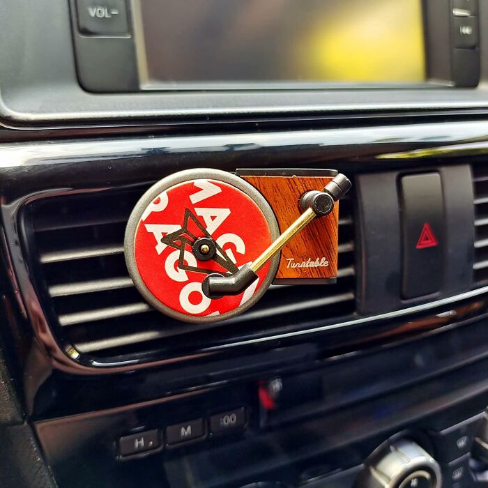 Unique gift idea: a retro-style turntable air freshener clipped to a car vent.