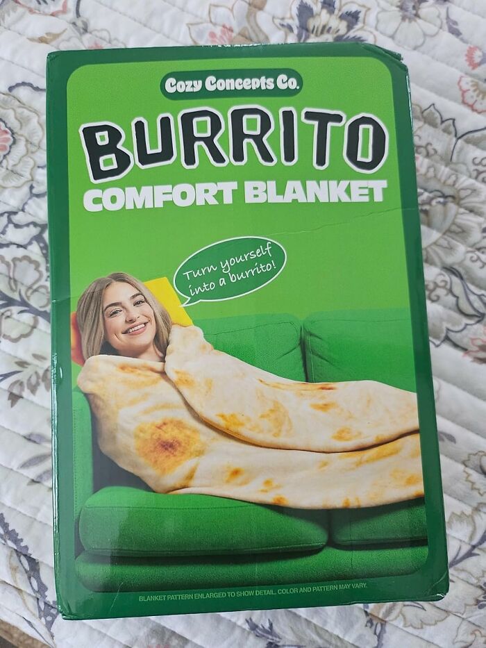 Burrito comfort blanket packaging showing a woman wrapped in a food-shaped burrito blanket on a green sofa.