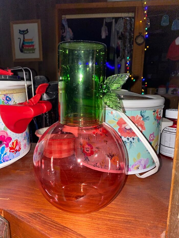 Colorful glass work supplies on a shelf, featuring floral designs and vibrant colors.