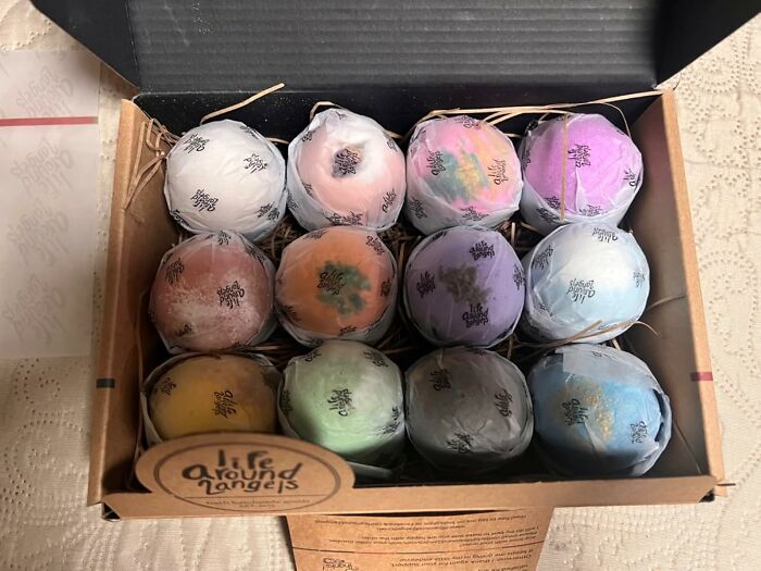 Box of colorful bath bombs, perfect for those living solo and needing a self-care boost.