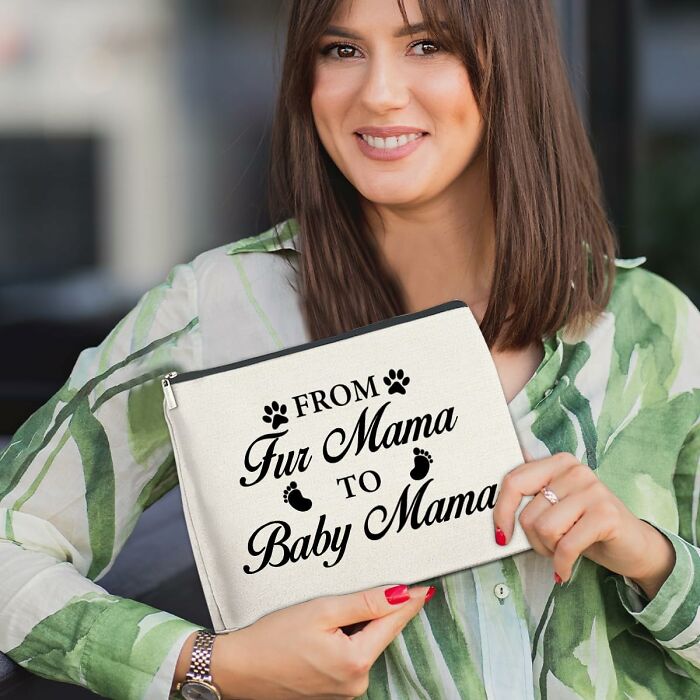 Woman smiling, holding a pouch with text, representing Amazon haul as a popular shopping choice.