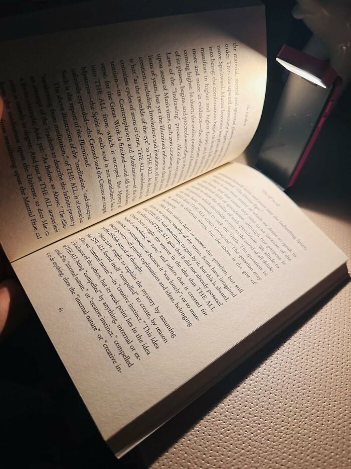 Open book illuminated by a small reading light, highlighting Amazon movers and shakers content.