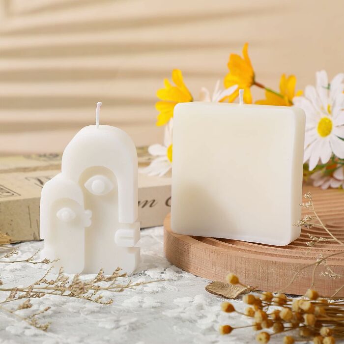 Unique wax candle designs with floral background.