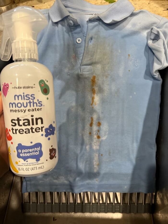 Miss Mouth's stain treater bottle next to a heavily stained blue shirt.