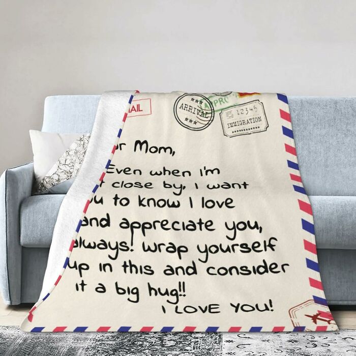 Cozy personalized blanket gift with loving message, perfect unique Mother's Day gift idea beyond socks and flowers.