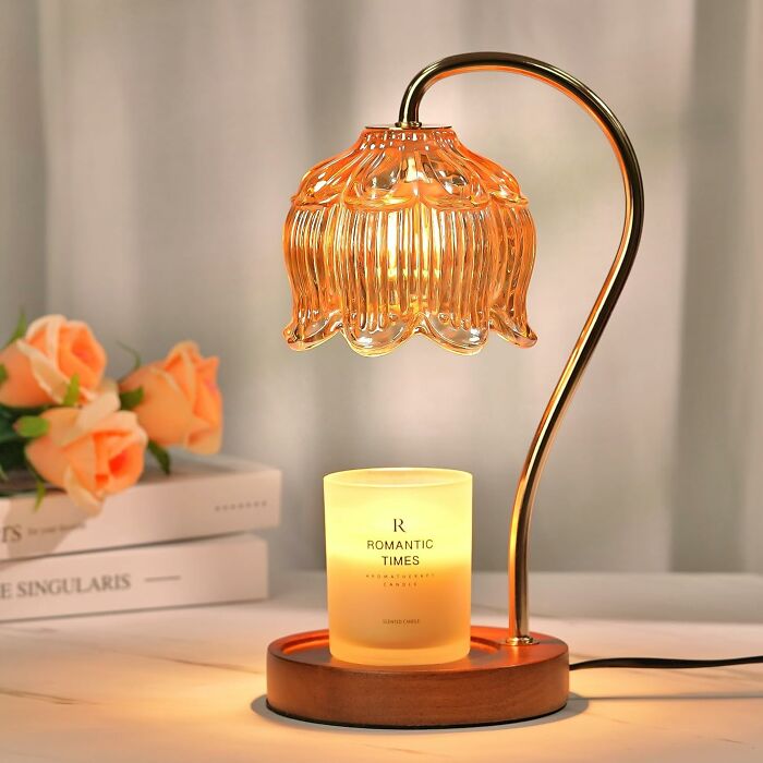 Elegant last minute Mother's Day gift idea with a glowing candle and vintage-style glass lamp on wooden base.