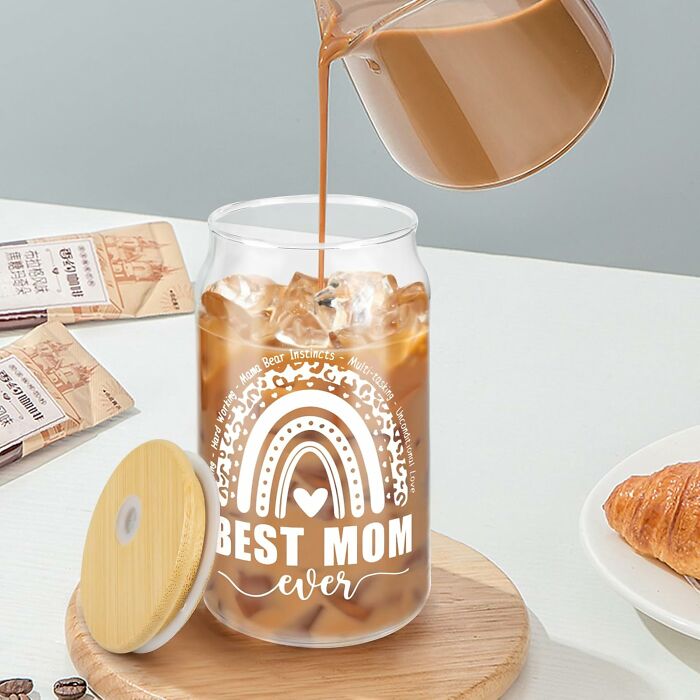 Iced coffee being poured into a Best Mom Ever glass, a thoughtful last minute Mother's Day gift idea.