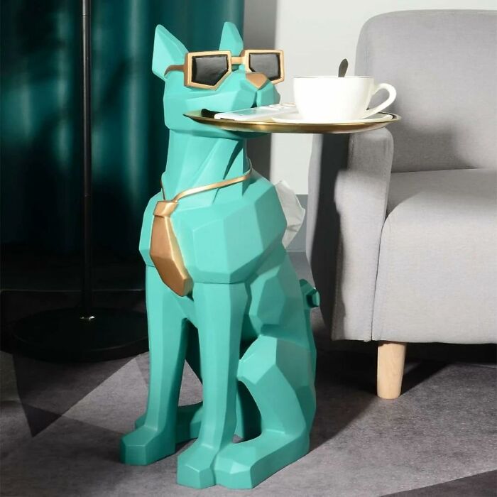 Stylish green dog statue with glasses holding a tray, adding character to a generic apartment.