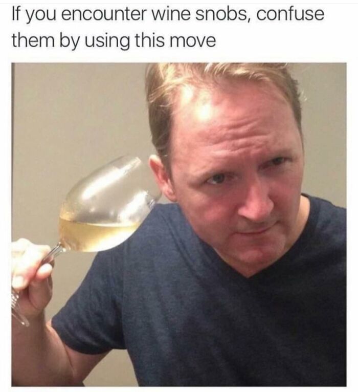 Man holding a wine glass to his ear in a funny meme to help insulate you from all the noise in the world.