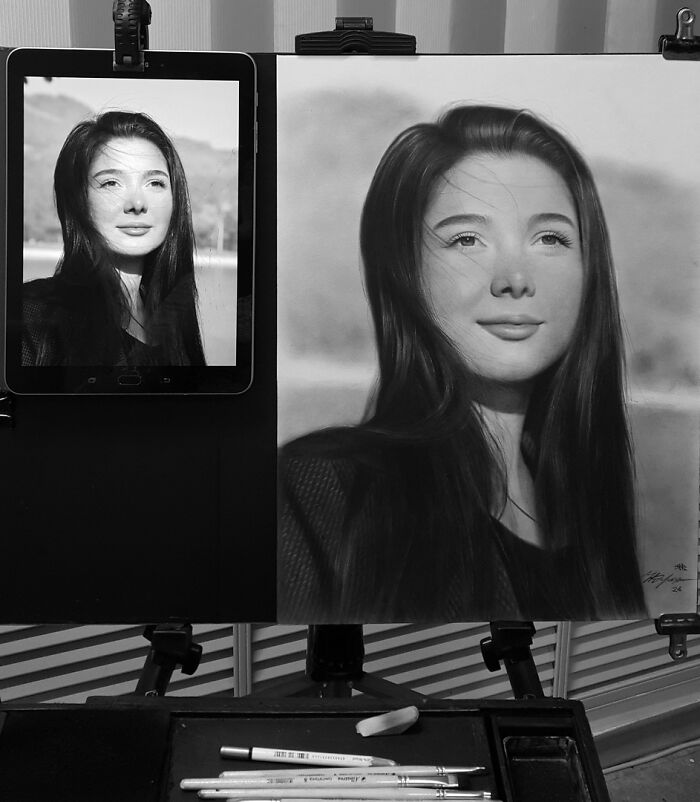 Hyper-realistic pencil portrait beside a tablet displaying the reference photo.