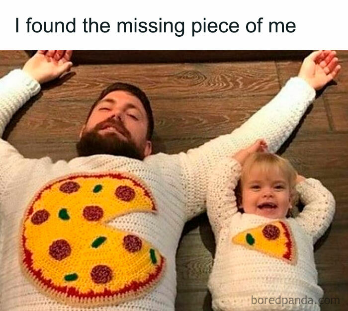 Dad and child in matching pizza sweaters, lying down, smiling. Relatable parenting humor.