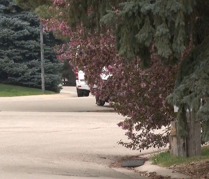 A quiet suburban street with trees, related to missing teen girl case found via Instagram message. A quiet suburban street with trees, related to missing teen girl case found via Instagram message.