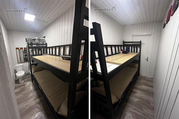Narrow real estate property with bunk bed doubled as table inside a compact living space for sale.