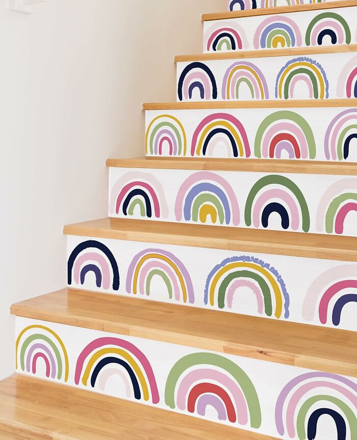 Wooden stairs decorated with colorful rainbow stickers, a playful item to unleash your inner child joy and creativity.