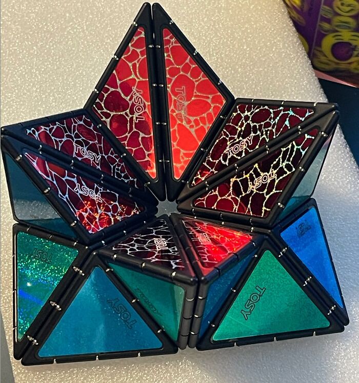 Colorful magnetic puzzle toy with reflective surfaces, one of the unique Amazon finds balancing genius and curiosity.