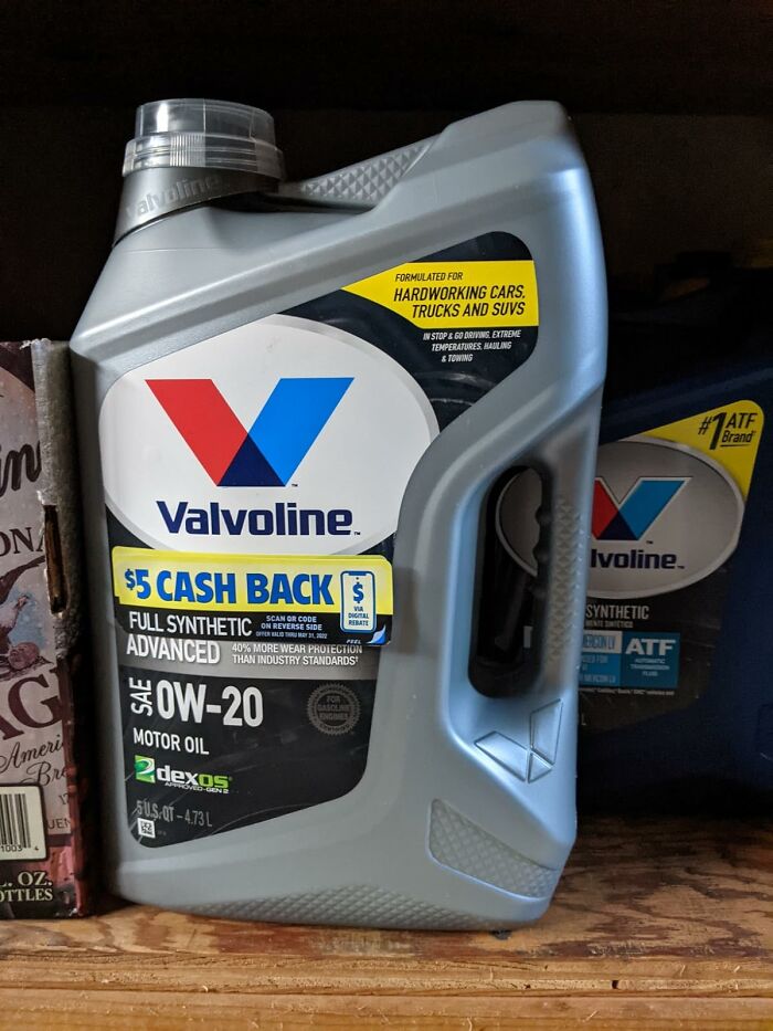 Container of Valvoline full synthetic motor oil SAE 0W-20 offering practical car advice for vehicle maintenance.