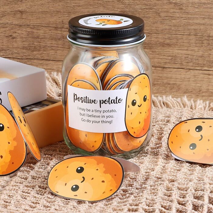 Jar of cute potato-themed notes labeled "Positive Potato," ideal unique gift alternative.