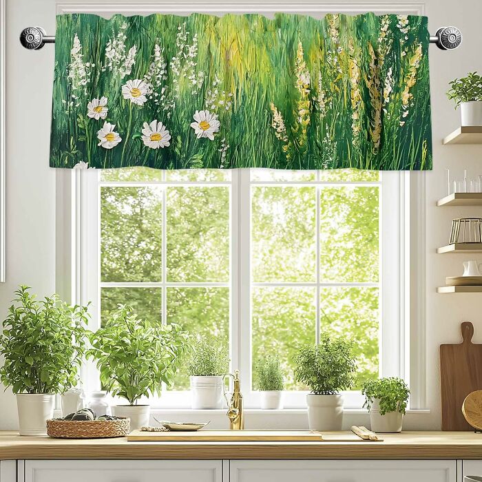 Kitchen window with floral curtains from Amazon Haul, framed by greenery and kitchenware.