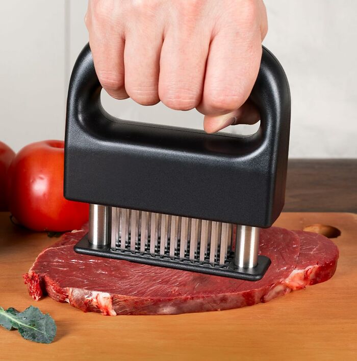Hand pressing meat tenderizer with metal blades on steak on wooden cutting board kitchen deals Amazon haul