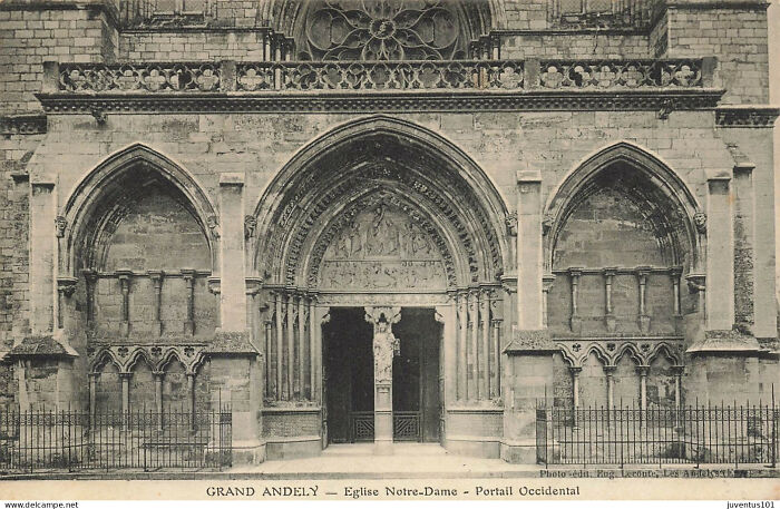 Gothic church entrance in Europe showing architectural details from life in Europe 100 years ago historic photo.