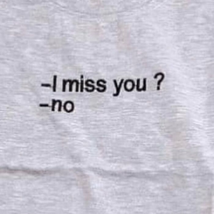 T-shirt with funny translation fail: "-I miss you? -no" in black text on gray fabric.
