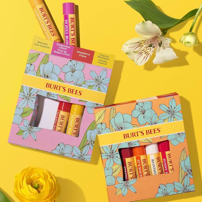 Easter basket treats: Burt's Bees lip balm gift sets on a bright yellow background with flowers.