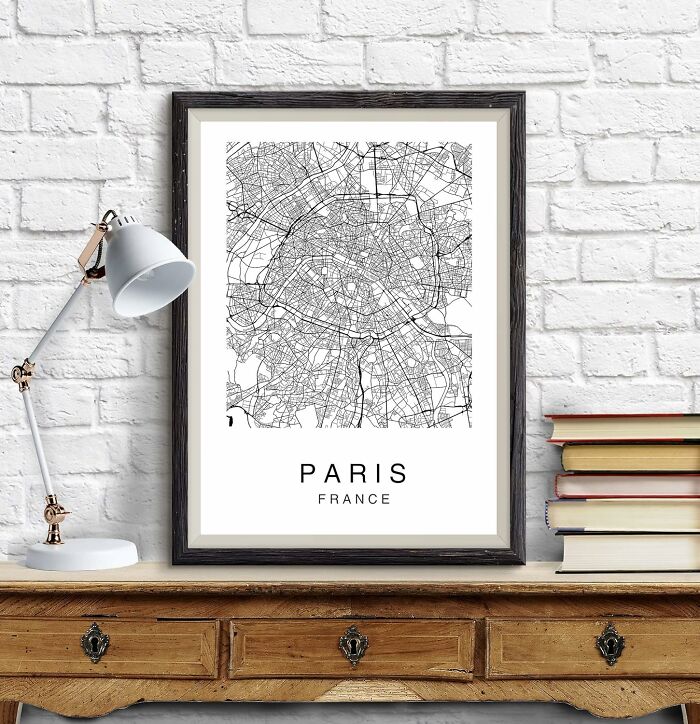 Framed map of Paris on a wooden desk, perfect unique gift idea.