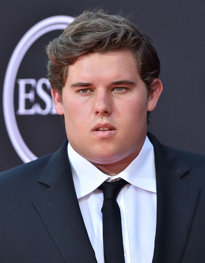 Man in formal attire at an event, showcasing impressive weight loss. Man in formal attire at an event, showcasing impressive weight loss.