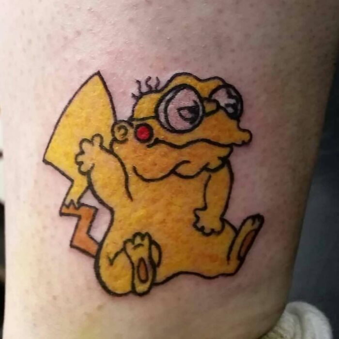 Simpsons tattoo featuring a character mix-up, blending elements humorously on skin.