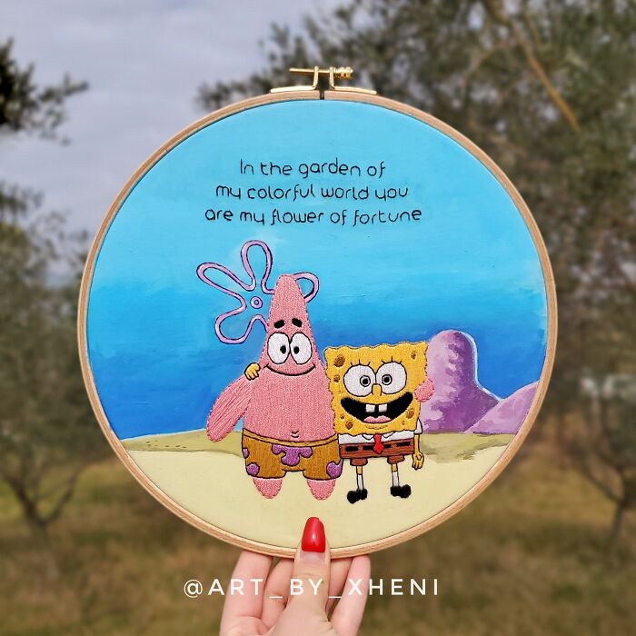 Embroidery art featuring two cartoon characters with a colorful background, emphasizing creative stitches and design.