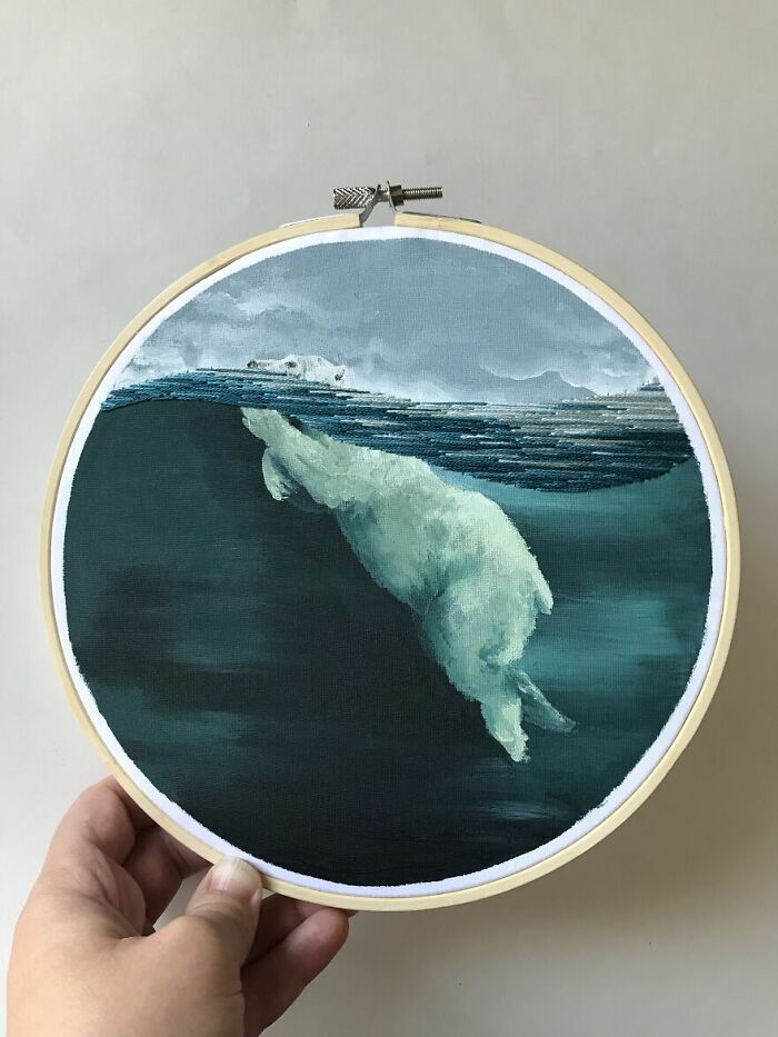 A detailed embroidery featuring a polar bear diving underwater, showcasing incredible embroidery artistry.