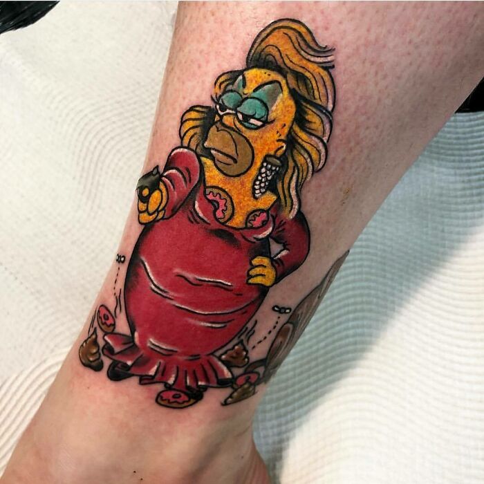 Tattoo of a character resembling Homer Simpson in a red dress, parody style.