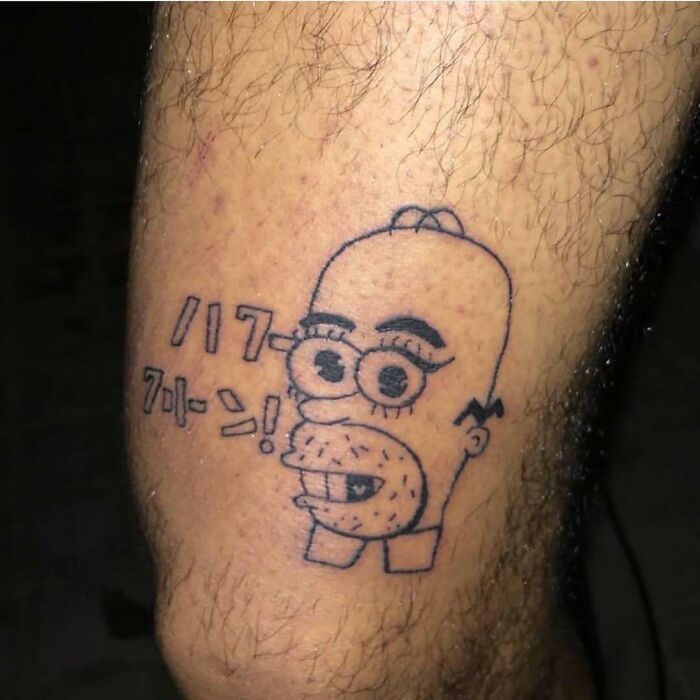 Simplistic Simpsons tattoo of Homer with Japanese text.