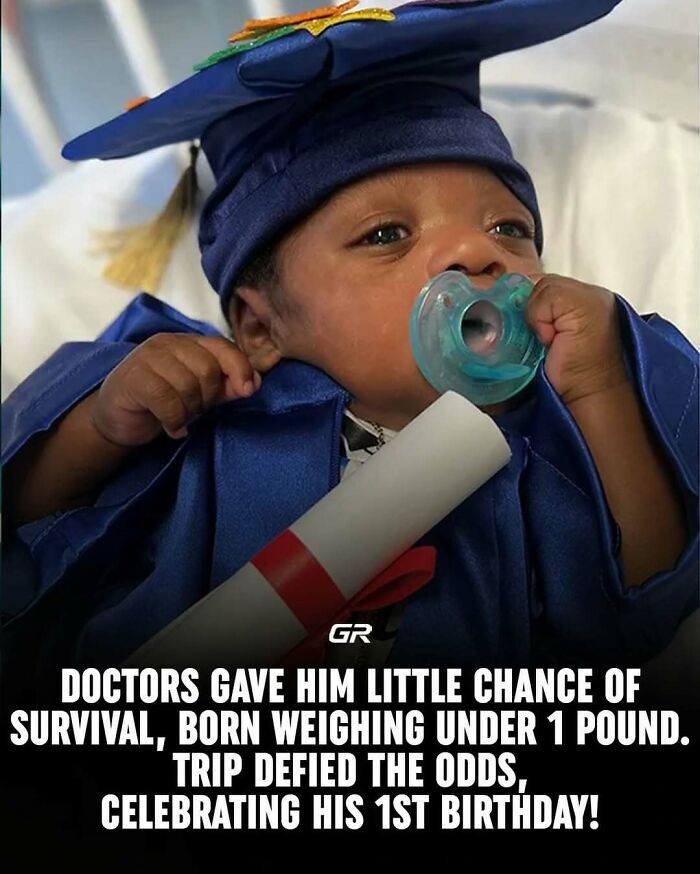 Baby wearing graduation cap with pacifier celebrates a milestone, symbolizing interesting facts about defying the odds.