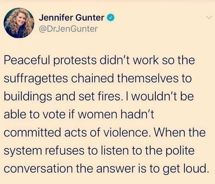 Text post on capitalism struggles, discussing historical suffragette protests and activism.