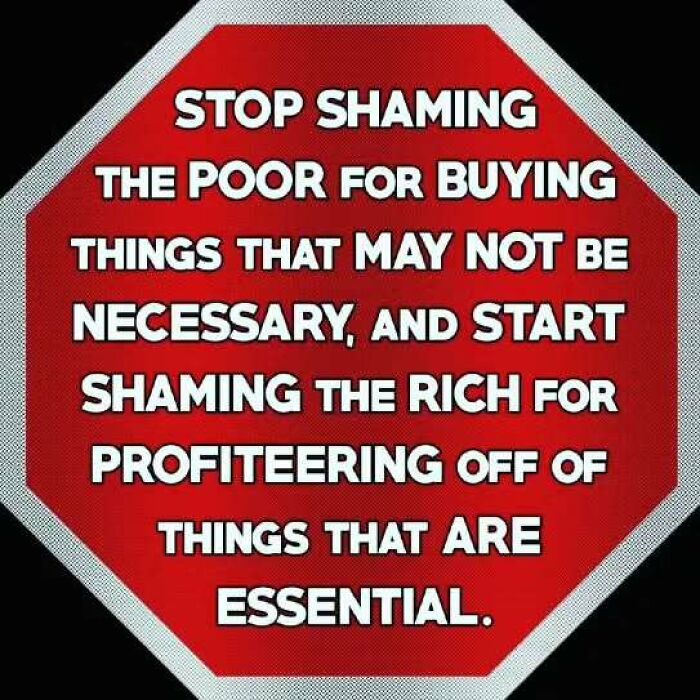 Stop sign with message on shaming the poor, highlighting anti-capitalism sentiment.