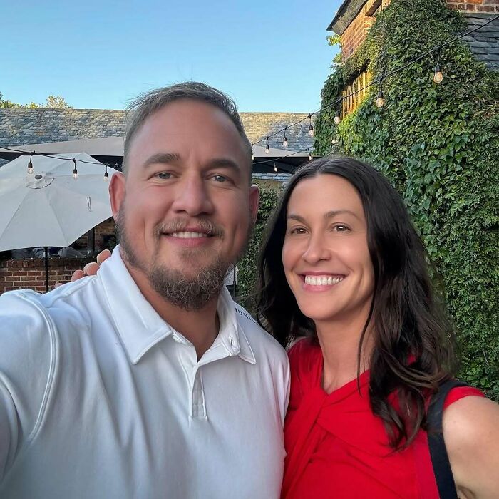 Man and woman smiling outdoors in a casual setting, illustrating celebrity encounters that went really well or terribly bad.